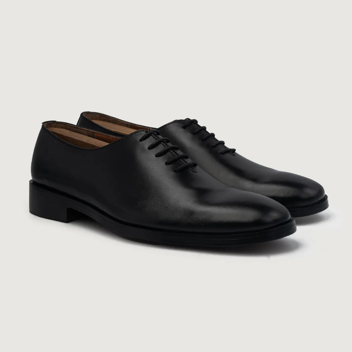 Director Wholecut Black Leather Shoes For Men in White Full-Grain Leather - Front Profile View & Tailored Silhouette | Buy Online