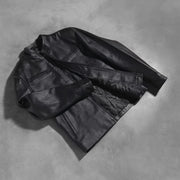 Styled Fit Perspective of Austere Matte Black Leather Biker Jacket on Model - Natural Daylight Drape