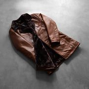 
Styled Fit Perspective of Men's Cinnamon Distressed Leather Fur Coat on Model - Natural Daylight Drape
