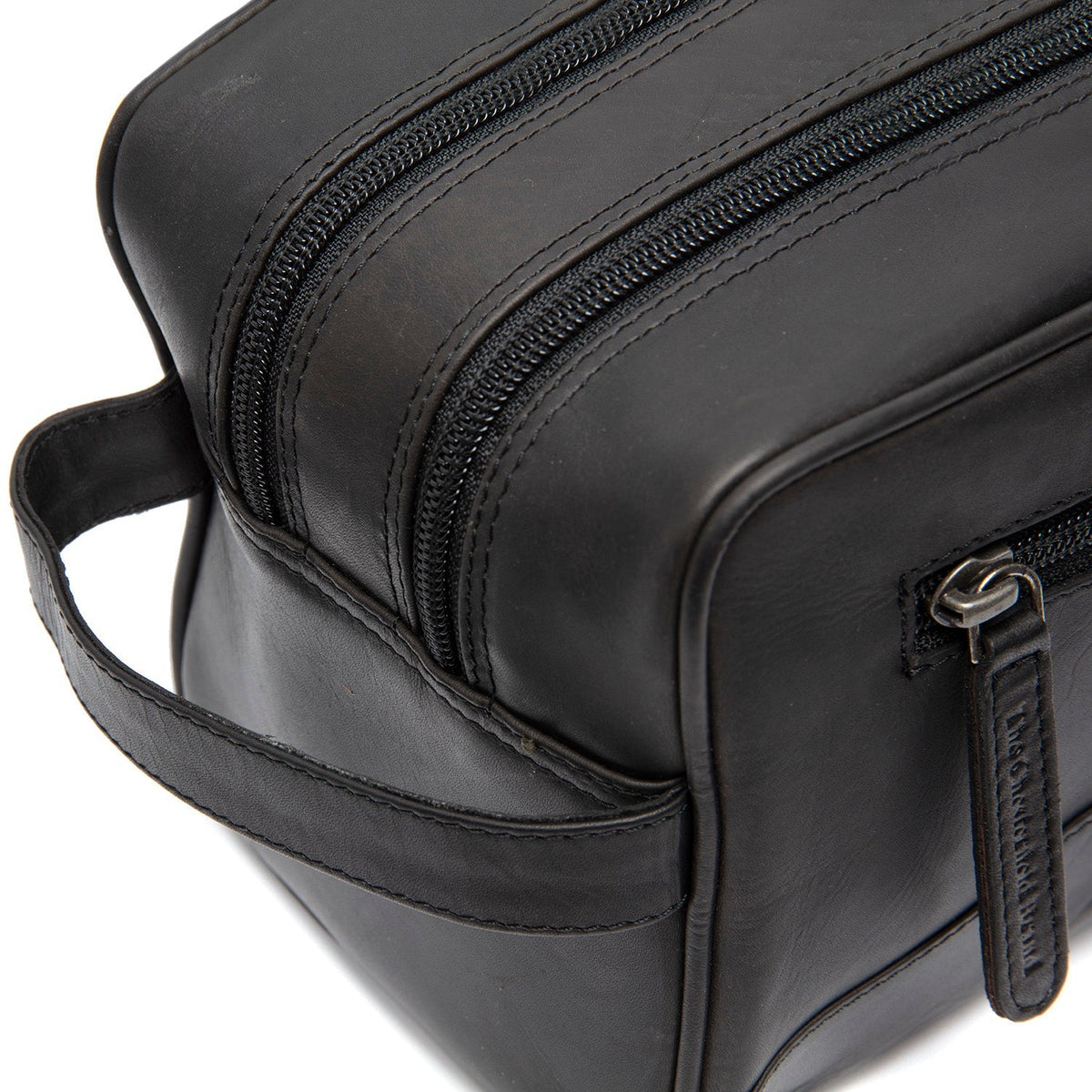 Close-Up Detail of Classic Collar &amp; Heavy-Duty Zipper Hardware on Stacey Full-Grain Leather Toiletry Bag