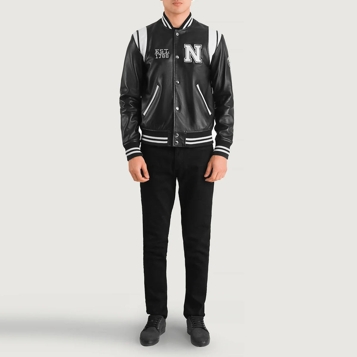 
Liberte New York Black Leather Varsity Jacket - Lateral Side Profile View Showing Sleeve Cut & Athletic Taper Fit